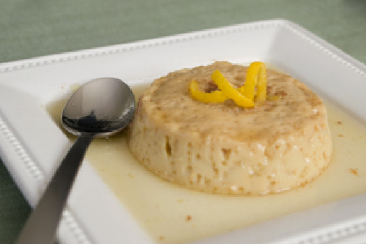 Flan on a plate with a spoon