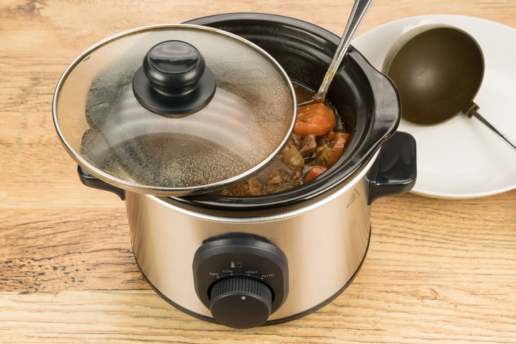 A slow cook crock pot meal on a kitchen work surface