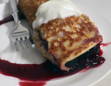 berry pancake roll up on plate