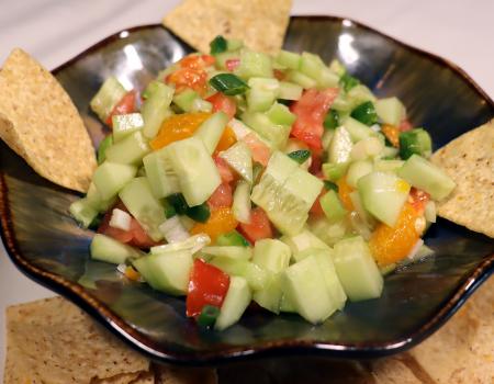 bowl of cool summer salsa with corn chips