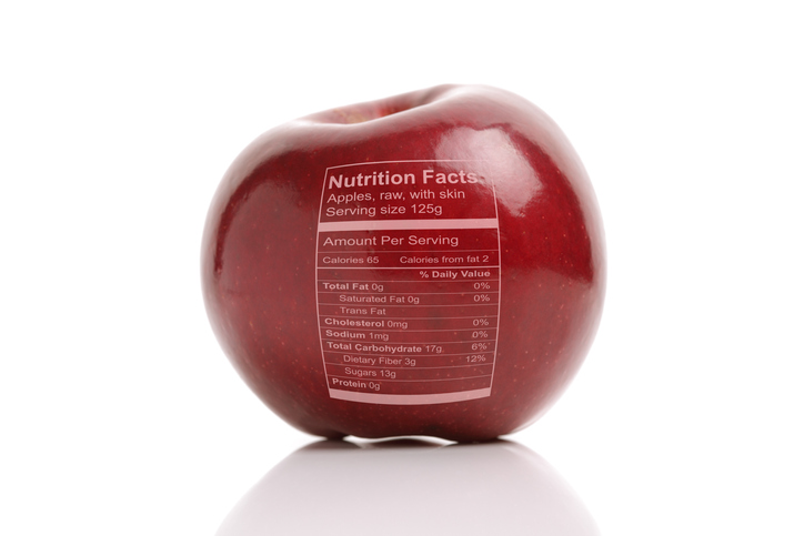 Apple with nutriton facts label, concept for healthy eating or dieting