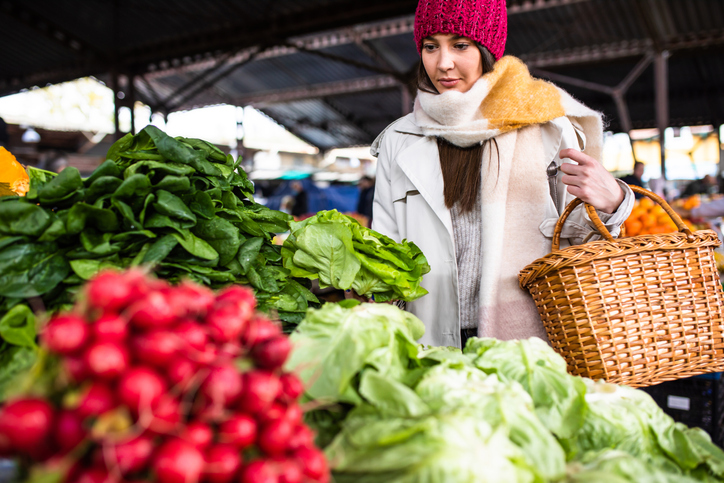 Woman shopping for produce in farmers’ market
