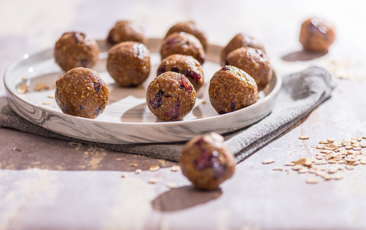 Oatmeal balls , Oats dates and cranberries energy balls, selective focus , close up