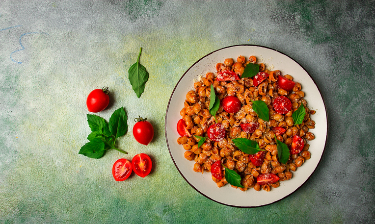 Tuscan pasta with smoked paprika and basil, parmesan cheese, Italian traditional cuisine,
