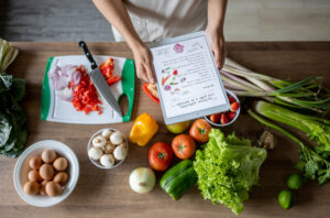 Close-up on a woman cooking at home following an online recipe