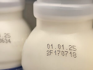 Select focus of the expiration date stamped on milk bottle. Expire date. Dairy product