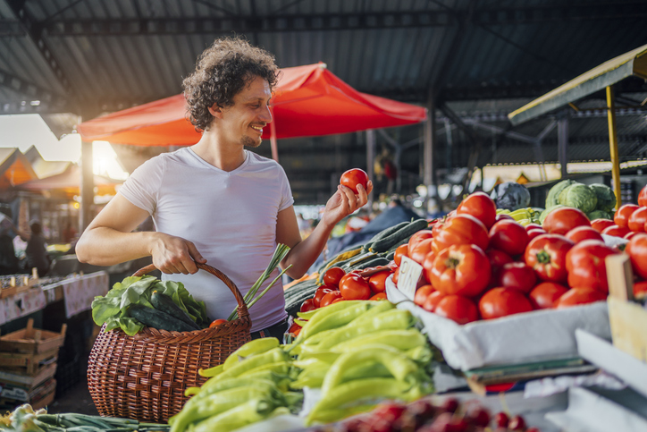 Man choosing tomatoes