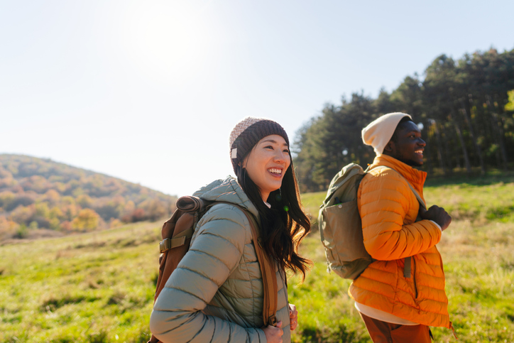 Smiling friends hiking together