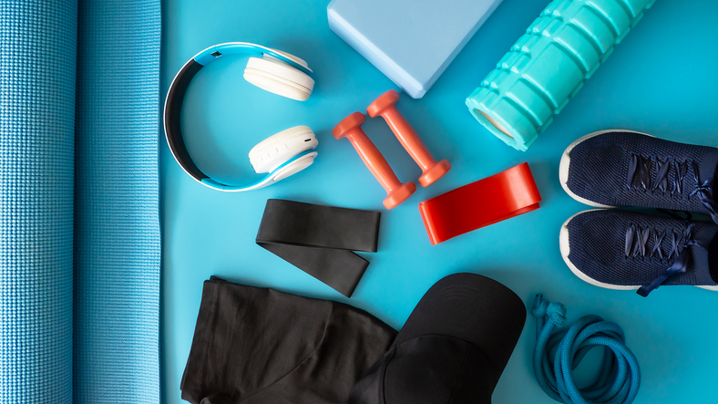 Sports equipment for fitness. Fitness and healthy lifestyle. Blue background.