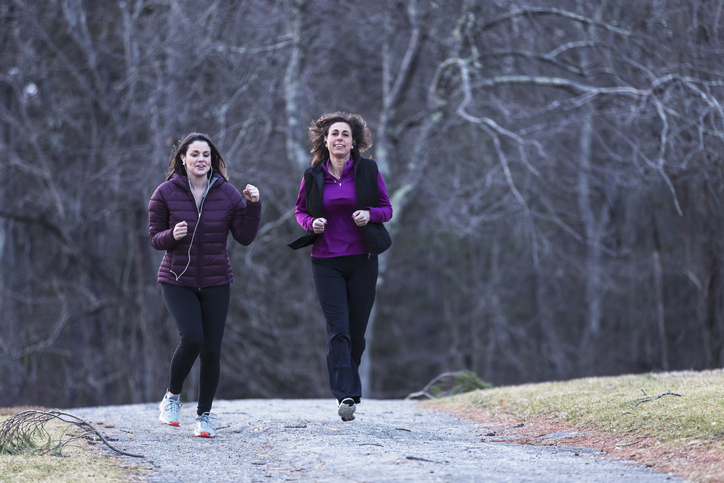 Mother and daughter jogging together for a workout